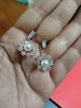 E0805_Elegant dazzling flower design rose gold american diamond stone studded earring with a touch of pearl.