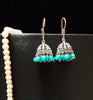 E0697_Classy german silver oxidized jumkas with delicate craft work with a touch of blue bead drops.