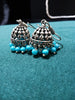 E0697_Classy german silver oxidized jumkas with delicate craft work with a touch of blue bead drops.