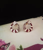 E0715_Classy crafted ring shaped earrings with a touch of flower design and stones.