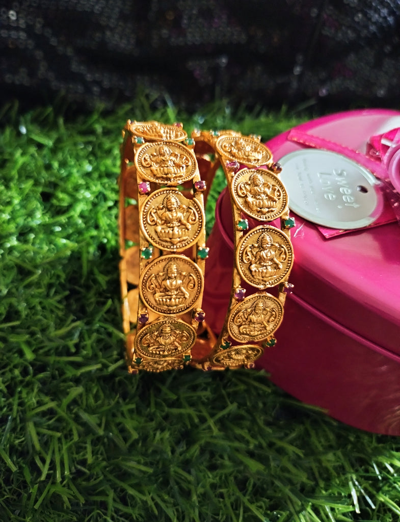 B0252 Lovely Ethnic style lakshmi design bangles with delicate work with a touch of green pink ruby stones