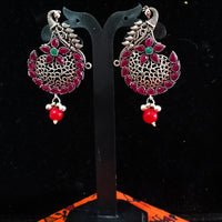 Silver oxidized earrings with pink ruby studded and exclusive silver work for a stunning and stylish look.