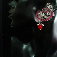 Silver oxidized earrings with pink ruby studded and exclusive silver work for a stunning and stylish look.