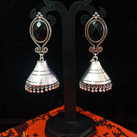 Silver oxidized earrings in Jumki pattern and exclusive silver work with black stone for a stunning and stylish look.