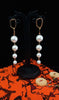 Stand-out dangler with non-precious metal base studded with pearls.