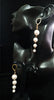Stand-out dangler with non-precious metal base studded with pearls.