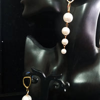 Stand-out dangler with non-precious metal base studded with pearls.