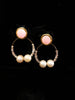 Stand-out dangler with non-precious metal base studded with pearls.
