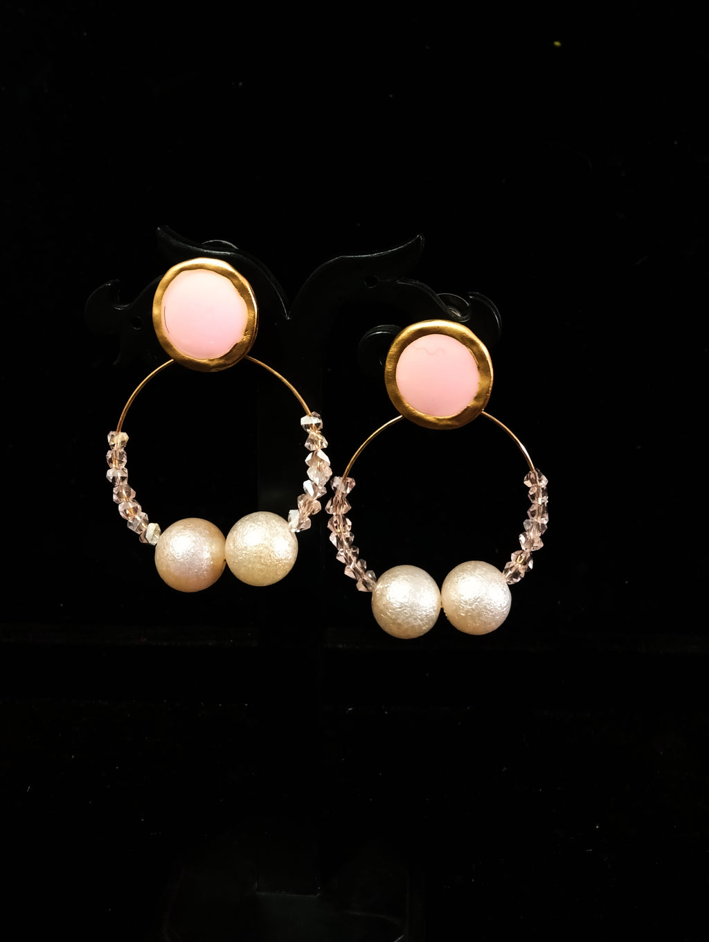 Stand-out dangler with non-precious metal base studded with pearls.