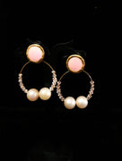 Stand-out dangler with non-precious metal base studded with pearls.