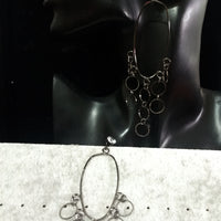 Stand-out dangler with beautiful black metal design.