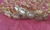 B0178_S_Elegant Rose Gold bangles embellished with American Diamond stones with a touch of dazzling pink stones.