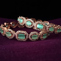 B0177_S_Elegant Rose Gold bangles embellished with American Diamond stones.