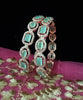 B0177_S_Elegant Rose Gold bangles embellished with American Diamond stones.