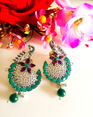 E0443_Gorgeous German silver oxidized danglers with peacock design studded with green and purple color stones with a touch of green and silver color bead drops (medium size)