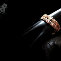 B038_Classy Style Rose Gold bangle studded with American Diamond stones with a touch of emerald.