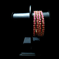 B022_S_Classy Style Gold plated Bangles studded with American Diamond stones .