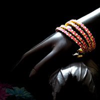 B022_S_Classy Style Gold plated Bangles studded with American Diamond stones .