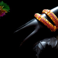 B034_Gorgeous Gold plated bangles matte finish studded with pink ruby stones.