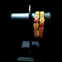 B035_Elegant Gold plated bangle with delicate work studded with pink ruby stones.