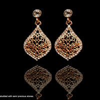 E040_Classy golden colored crafted earring with delicate work of white stone