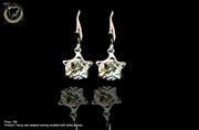 E061_Classy silver crafted earring with delicate work of white stone.