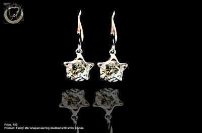 E061_Classy silver crafted earring with delicate work of white stone.