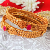 B035_Elegant Gold plated bangle with delicate work studded with pink ruby stones.