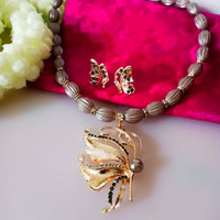 N0295_1 Lovely trendy butterfly design necklace set with glossy bead work studded with a touch of stones.