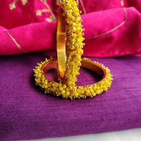 B0273_Lovely golden pearl bangles with delicate craftwork embellished with a bunch of yellow beads.