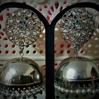 E0116_ Glamorous Base Metal jumkas studded with premium stones with a touch of pearls.