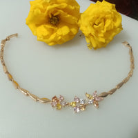 B045_Gorgeous Rose gold base bracelet studded with semi precious stones.