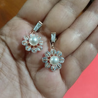 E0805_Elegant dazzling flower design rose gold american diamond stone studded earring with a touch of pearl.
