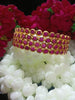 B0154_Elegant pink ruby studded bangles with fine stone work.