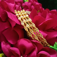 B0164_Elegant Golden sleek bangles studded with a touch of American Diamond stones.