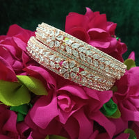 B0152_S_ Exquisite Rose Gold plated bangles with delicate art work studded with  American Diamond stones.