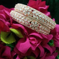 B0152_S_ Exquisite Rose Gold plated bangles with delicate art work studded with  American Diamond stones.