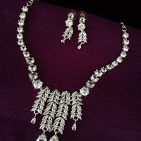 N0257_Beguiling crafted necklace set embellished with American Diamond stones with delicate stone work along with Chain drop pattern of stones.