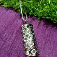 N0276_Trendy black metal chain with crafted cylinder shaped pendant filled with a touch of stones.