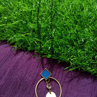 N0277_Trendy bead necklace with a circular shaped pendant with a touch of stones.