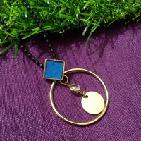 N0277_Trendy bead necklace with a circular shaped pendant with a touch of stones.