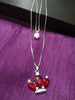 N0281_Classy necklace with crown shaped pendant with sparkling red and white stones.