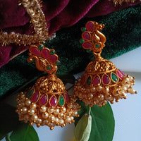 E0836_Gorgeous golden jumkas with peacock design studded with ruby stones with a bunch of bead drops.