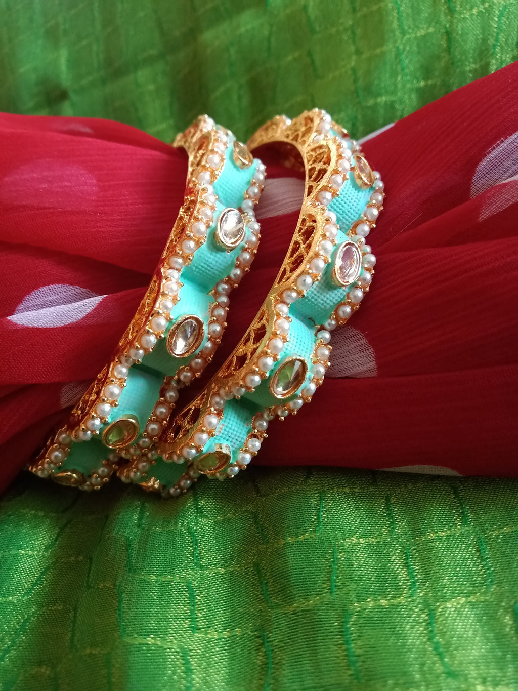 B0218_Gorgeous bangles with vibrant Meena work with a touch of semi precious stones.