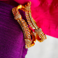 B0267_Lovely designer Gold plated bangles studded with  American Diamond  stones with delicate stone work.