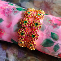 B0288_Beautiful flower design golden bangles with delicate craftwork with a touch of ruby stones.