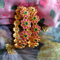 B0288_Beautiful flower design golden bangles with delicate craftwork with a touch of ruby stones.