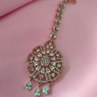 M026_Classic flower design oval shaped rose gold American diamond studded Maang tika with delicate stone work.