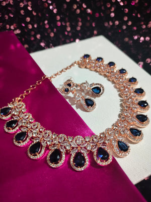 N0550_Lovely rose gold choker necklace embellished with american diamond stones with a touch of blue stones.