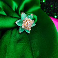 R067_Gorgeous flower design American Diamond studded statement ring studded with sea green color stones.